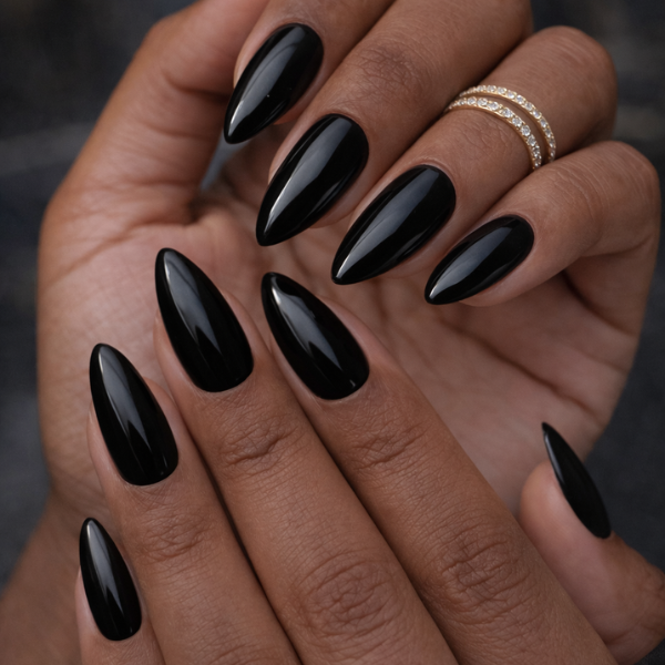 Midnight Luxe glossy black almond press on nails on model hands