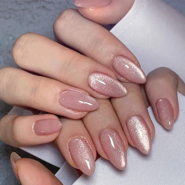 press-on nails Rosé Sparkle nude pink glitter almond on model hands