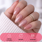press-on nails Rosé Sparkle nude pink glitter almond on model hands