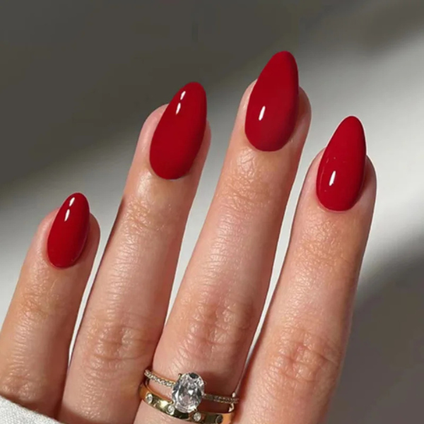 press-on nails Scarlet Elegance glossy red almond on model hands