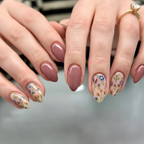 Secret Garden floral almond press on nails with mauve polish and delicate flower design